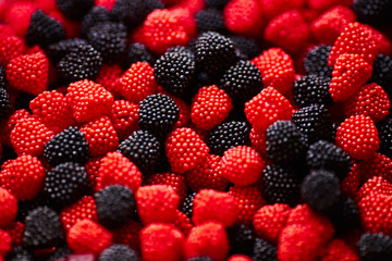 Fruit jelly in the form of colored berries close-up. background