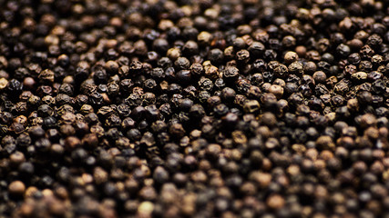 black, white, red peppercorns spice. Closeup Background