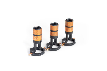 Alternator slip rings on isolated white background. Auto electrical parts.