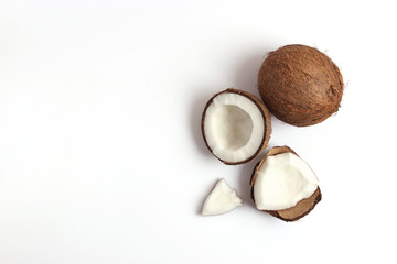 Fototapeta na wymiar broken coconut on a white background top view.