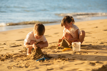 Kids making sand castle on the beach