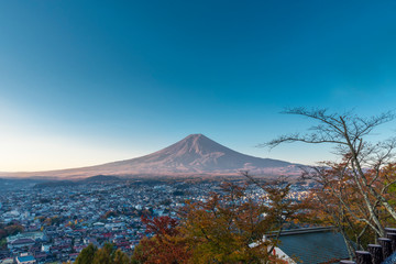 Fototapeta na wymiar Fuji mountain with branches of tree in autumn season in Fujiyoshida, Japan.