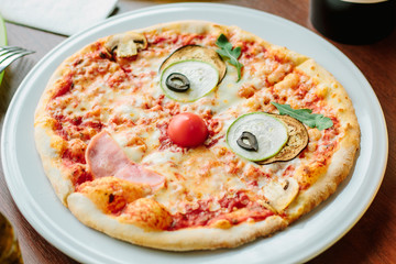 Funny face pizza for kids in a restaurant.