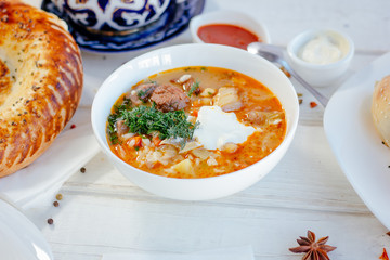 Mastava - uzbek rice soup on white table.