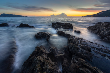 stone on the beach in twilight, kalim beach, Patong, phuket, Thailand. 