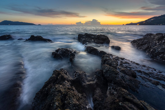 stone on the beach in twilight, kalim beach, Patong, phuket, Thailand. © suksamranpix
