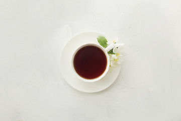 cup with tea on a white textural background