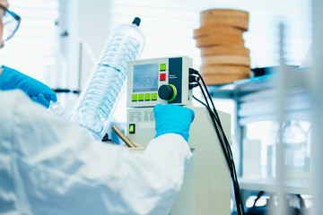 Woman Scientist giving command to the Rotary Evaporator machine at modern laboratory