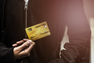 Hands holding plastic credit card for pay. This is Shopping concept