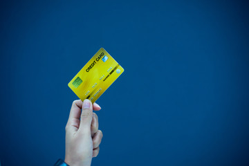 Hands holding plastic credit card for pay. This is Shopping concept