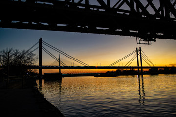 Old railway bridge and sunset over sava river