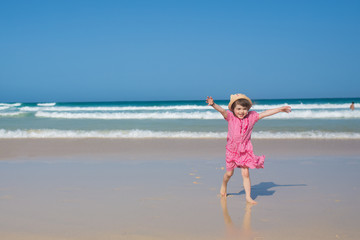 Little girl running on the beach