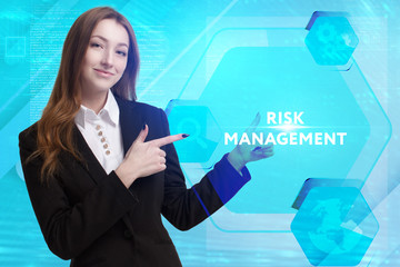 The concept of business, technology, the Internet and the network. A young entrepreneur working on a virtual screen of the future and sees the inscription: Risk management