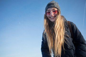 portrait of young woman with pink sunglasses