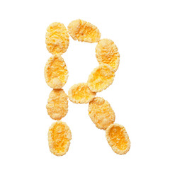 Yellow cornflakes letter R isolated on white background. Alphabet cereal flakes.