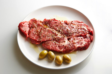 Fresh raw seasoned beef with olive oil