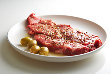 Fresh raw seasoned beef with olive oil