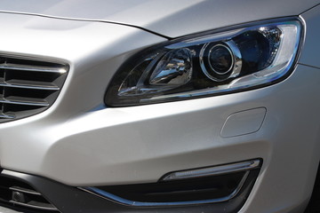 Obraz na płótnie Canvas Silver luxury vehicle headlight 