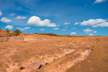 Dry, orange soil and blue sky in the countryside of Oeiras - Piaui state, Brazil (Sertao landscape)