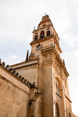 Fototapeta premium iluminated tower in cordoba mosque from down to the sky in Spain