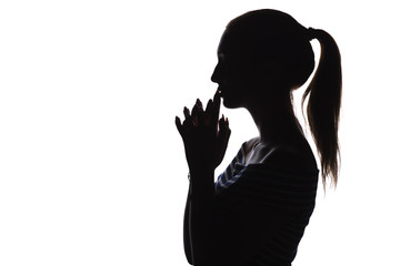silhouette of serious thoughtful girl with arms folded near the china teenager, unrecognizable woman face profile on a white isolated background,, concept age, problems, religion, life