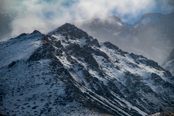 snow on the mountain and clouds 