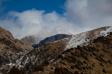 snow on the mountain and clouds 