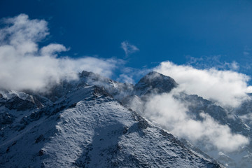 snow on the mountain and clouds 