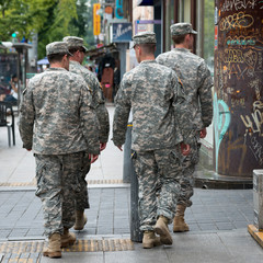 Army soldiers walking on sidewalk, Seoul, South Korea
