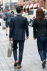 Obraz premium Business executives walking on sidewalk, Seoul, South Korea