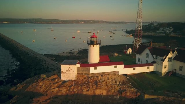 Eastern Point Lighthouse sunrise aerial shot in Gloucestor, Massachusetts  