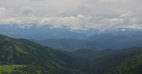 Naklejka premium Hiking with a tent through Petros to Hoverla, Lake Nesamovite, Mount Pop Ivan Observatory.