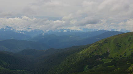 Naklejka premium Hiking with a tent through Petros to Hoverla, Lake Nesamovite, Mount Pop Ivan Observatory.