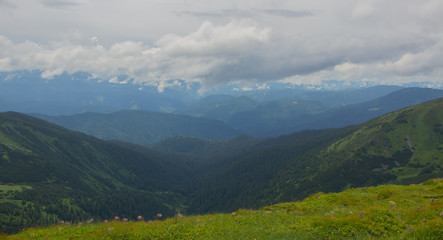 Fototapeta premium Hiking with a tent through Petros to Hoverla, Lake Nesamovite, Mount Pop Ivan Observatory.