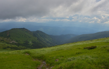 Naklejka premium Hiking with a tent through Petros to Hoverla, Lake Nesamovite, Mount Pop Ivan Observatory.