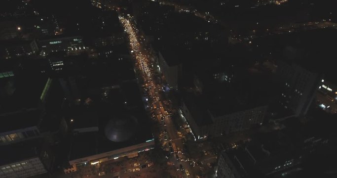 Aerial view of the intersection at night, Ukraine / Kiev. Top view in intersection with cars at night. Taken from the drone in RAW format 4K.