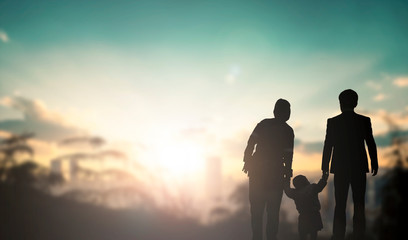 Family concept: family at sunset background