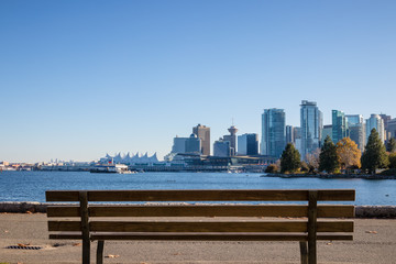 Landmark of Vancouver, British Columbia. View from Stanley Park and seawall in Vancouver, Canada. It is largest urban park with beaches, trails, scenic seawall