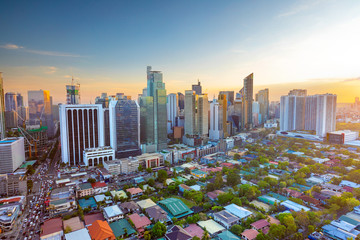 Elevated, sunset view of Makati, the business district of Metro Manila,  Philippines