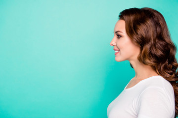 Fototapeta premium Close-up profile side view portrait of her she nice-looking sweet perfect feminine cheerful cheery wavy-haired girl isolated over bright vivid shine blue background