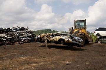 smashing cars at the junkyard car crushing