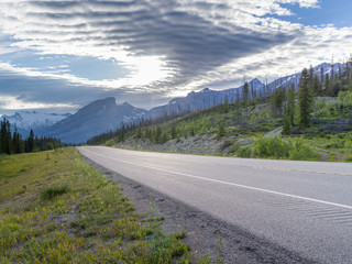 Highway with mountains in the background, North Saskatchewan River, David Thompson Highway, Clearwater County, Alberta, Canada
