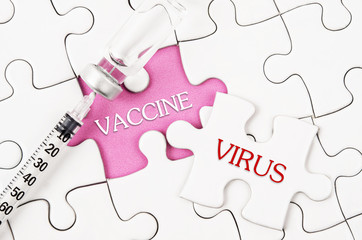 vaccine, virus word write on puzzle, jigsaw with vaccine bottle.