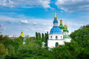 Fototapeta na wymiar Beautiful view on Vydubychi Monastery in Kyiv, Ukraine. Summer cloudy day.