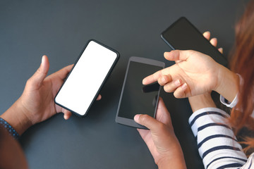 business people discussing using smart mobile phone