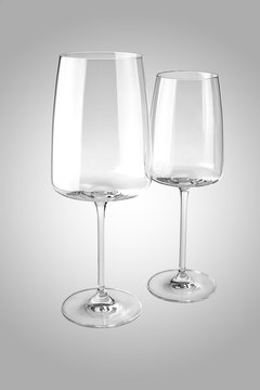 Two empty wine glasses isolated on white