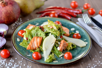 fresh salad with salmon and gorshey on a plate