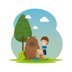 cute little boy with dog and food bag in the landscape