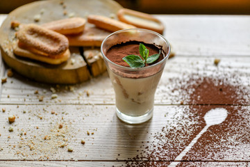 tiramisu dessert in a glass on the table