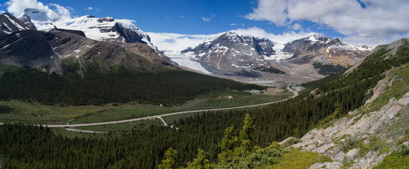 Road passing through mountainous landscape with glacier in the background, Columbia Icefields, Icefields Parkway, Jasper, Alberta, Canada